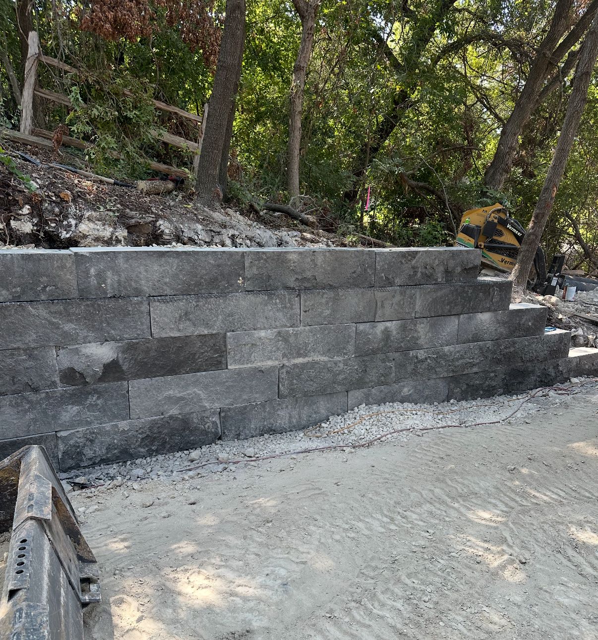 Charcoal limestone block retaining wall with steps