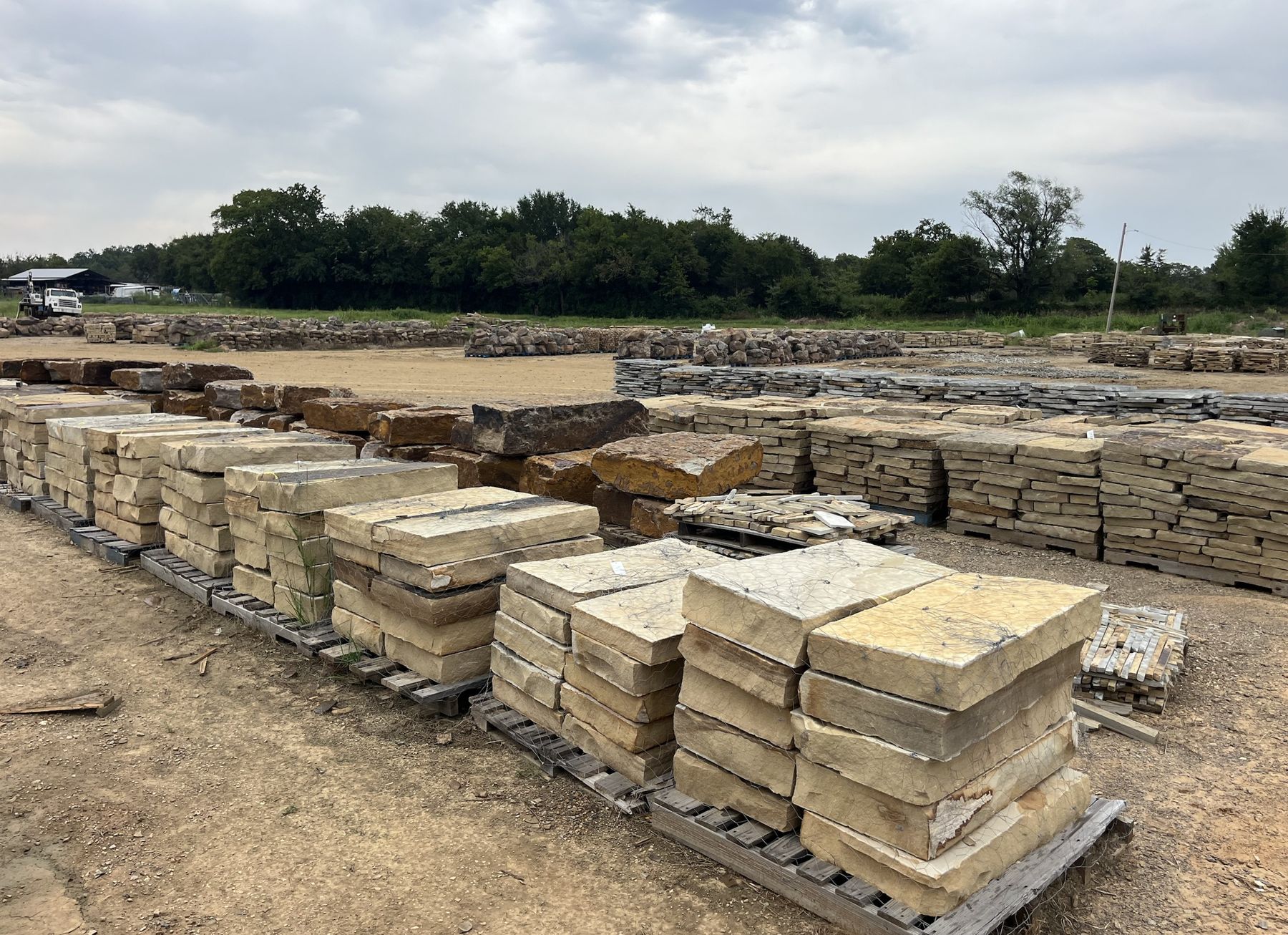 Stone yard with pallets of chop and flagstone
